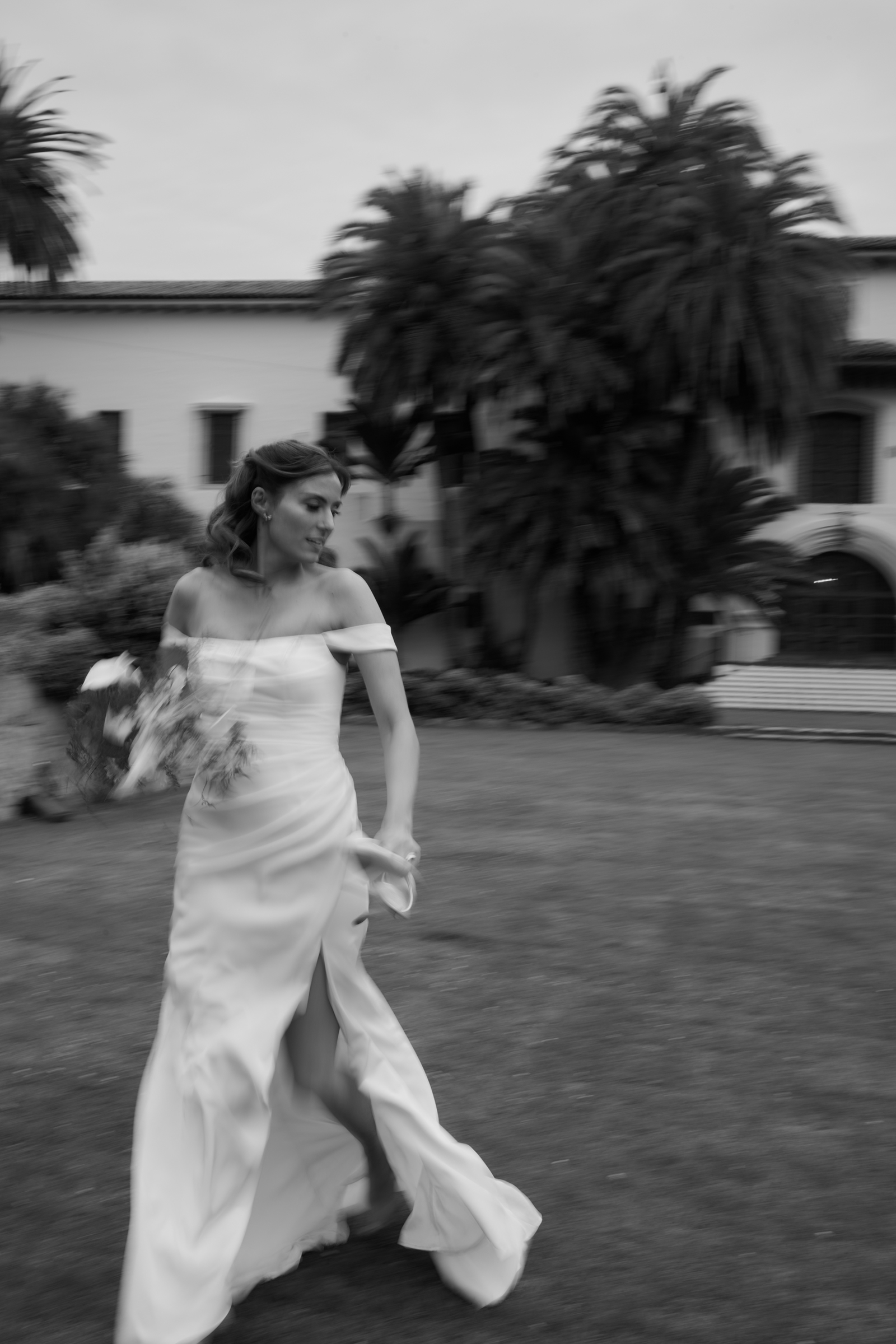 bride-walking-santa-barbara-courthouse-gardens-motion-blur-wedding
